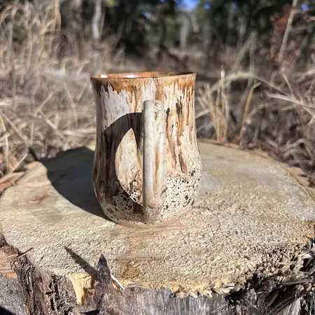 Woodland inspired mug, speckled clay meets a speckled glaze and a warm brown drippy glaze 