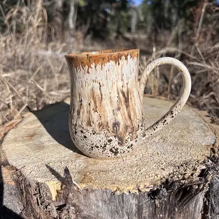 Woodland inspired mug, speckled clay meets a speckled glaze and a warm brown drippy glaze 