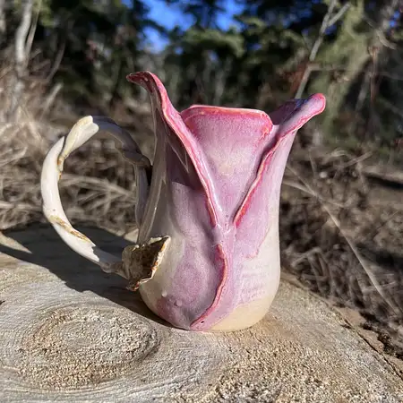 Wheel thrown cup featuring sculpted clay to add unique detail to every rosebud cup.