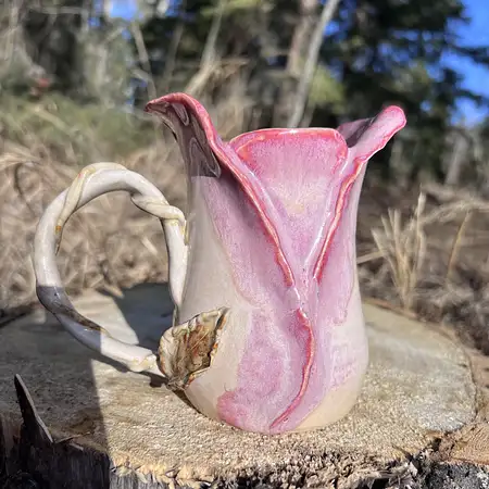 Wheel thrown cup featuring sculpted clay to add unique detail to every rosebud cup.